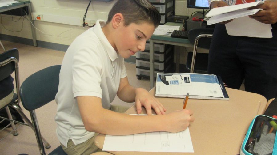 Harris working in Mr. Martins math room. Harris credits his win to his work ethic and strong participation.