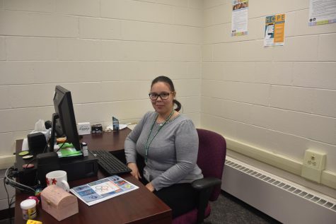 Program Coordinator Priscolla Carillo-Coleman 
 prepares her office and the space for the official opening.