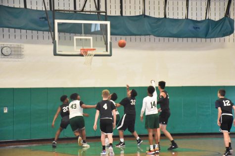 Omari Chambers (43) prepares to box out the competition for an offensive rebound.